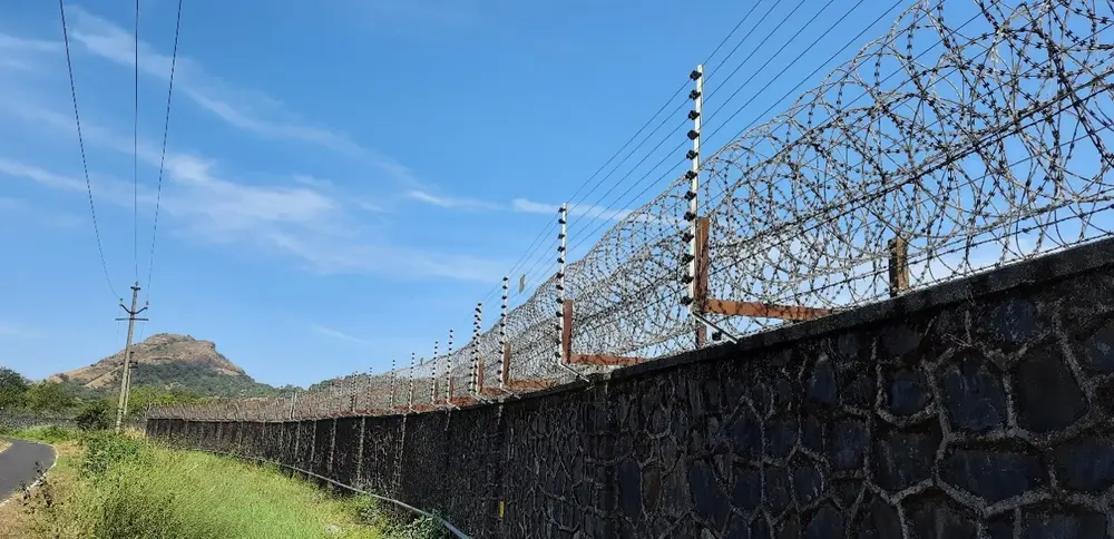 Wall-top electric fencing